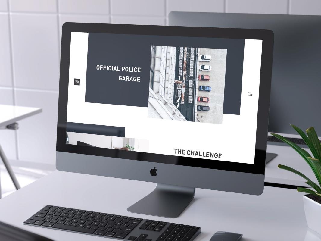 A website for Official Police Garage shown on a desktop monitor