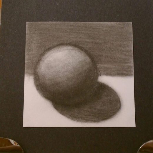 Charcoal drawing of a shaded sphere and its shadow